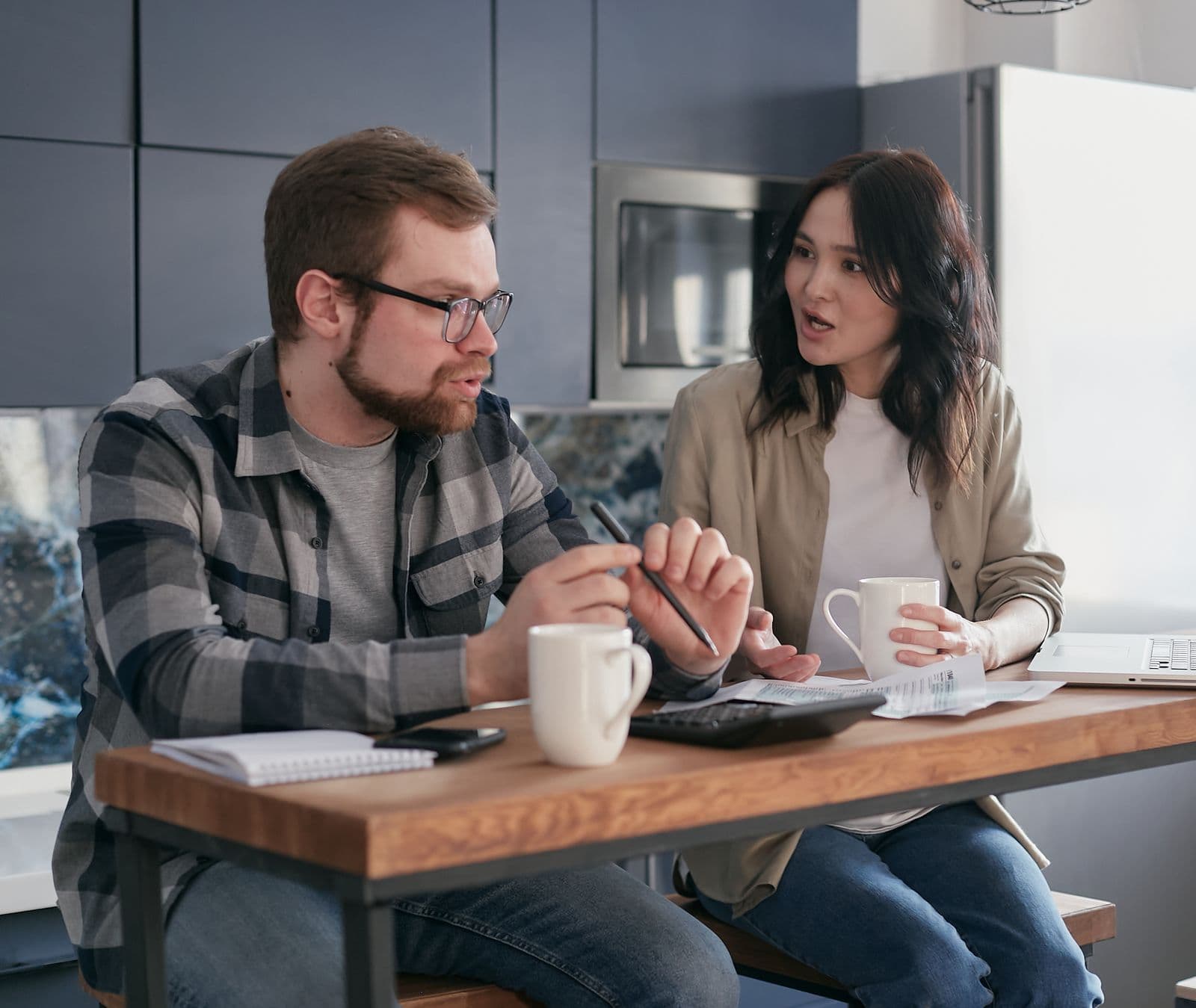A couple talking through their coverage choices at home