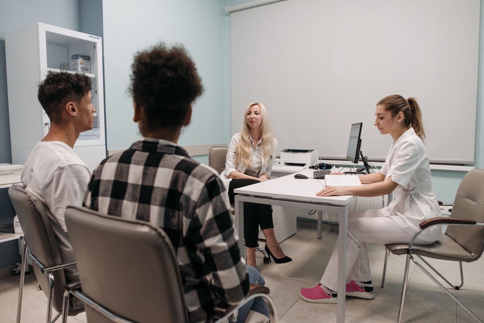 A couple meeting with a doctor at a local clinic